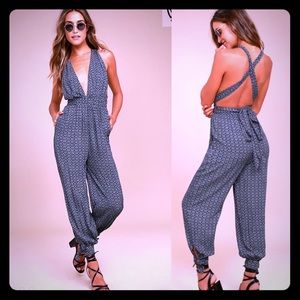 Lulu’s Take a Trip Black Print Halter Jumpsuit